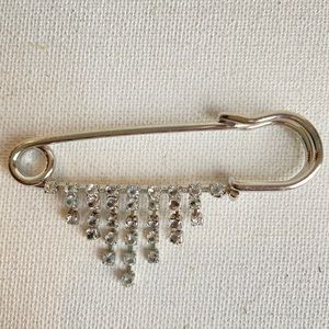 Oversized safety pin brooch with sparkly cascade of rhinestone dangles vintage